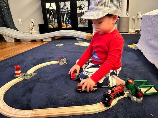 Loves his first train set