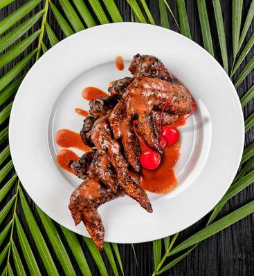 Cherry BBQ chicken wings entree. 5 whole chicken wings fried naked and crispy, tossed in a tangy, full bodied cherry citrus BBQ sauce.