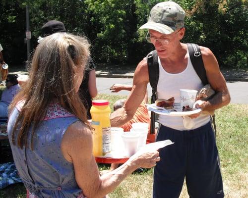 Sharing a picnic meal with homeless neighbors