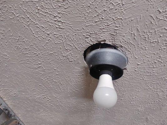 Garage light fixture loose.