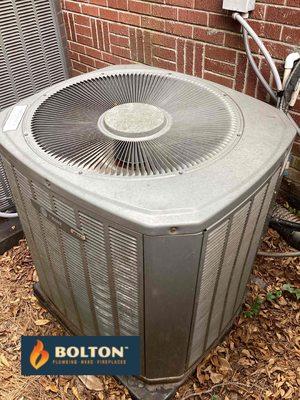 Checking HVAC Unit by Bolton Plumbers, HVAC, Fireplaces. Call (770) 674-6868