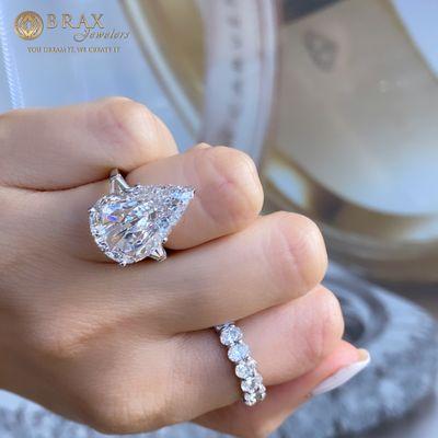 One of our favorite custom engagement rings! Paired with a stunning oval band.