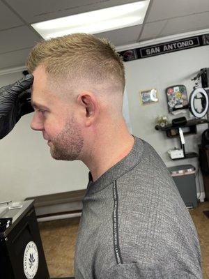 Mid-high fade with short fohawk and shadow beard lining