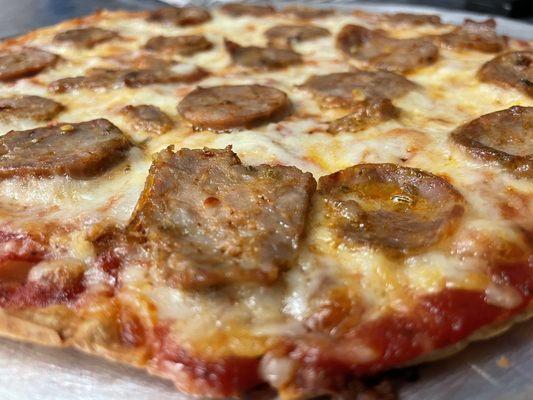 Locally made sausage pizza.