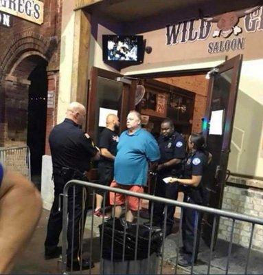 Old manager being arrested for pepper spraying patrons before he attacks them.