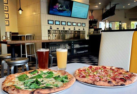 On the left - my delicious Walla Walla veggie pizza with extra basil and to the right - Supreme pizza with pepperoni and sausage!