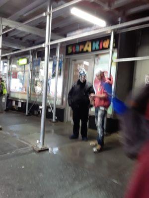 Allied security guard wearing scary mask