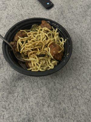 H1. General Tsos Chicken with lo mein and a fully cooked cockroach