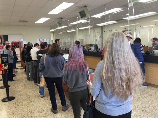 22 people waiting in line for a teller at 2pm!