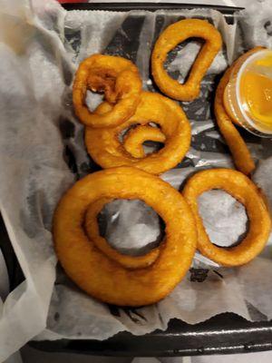 Onion rings. The wax paper looks wet but it's all grease