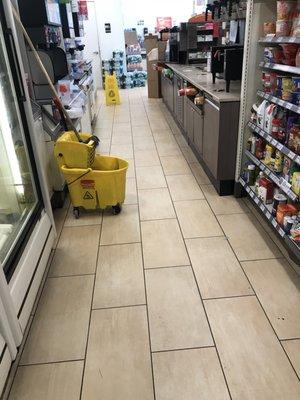 Mop and mop bucket in the aisle