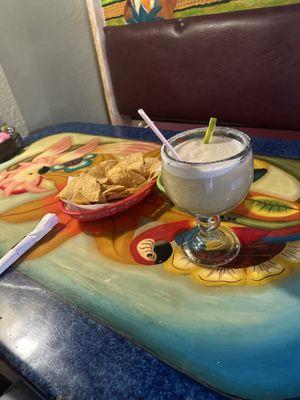 Chips and salsa with a frozen margarita.