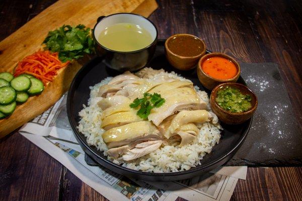 Hainanese poached Mary's non-GMO Free-Range chicken over chicken rice, accompanied by favorite sauces.