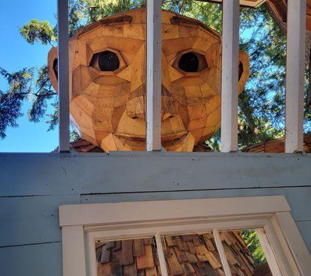 You can go inside the house to meet the troll's stare.