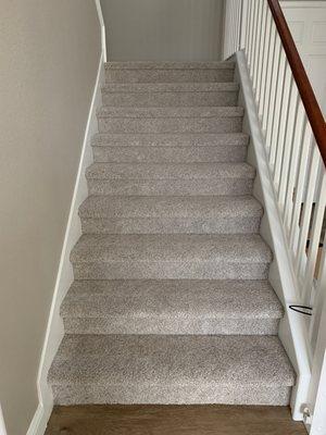 Carpet on the stairs and second floor.