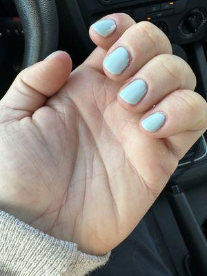 Polish has uneven edges and does not cover the whole nail.