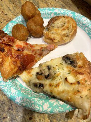 White pizza with added mushrooms Meat lovers pizza Fried mushrooms Garlic knots