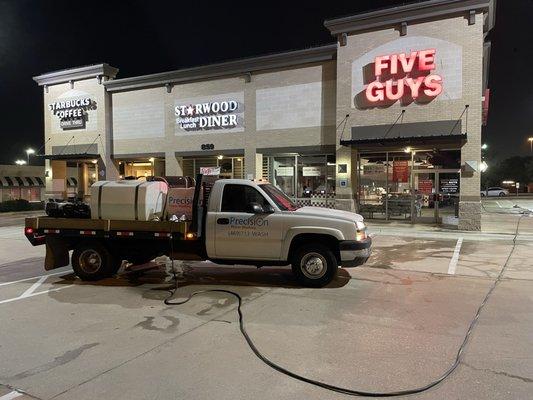 Commercial Power Washing in Lewisville, Texas. Remove Chewing gum spots, oil stains and coffee stains from shopping center.