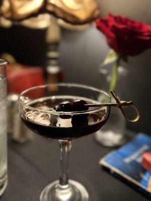 Black Moonhattan made with Four Roses Bourbon, Amaro, Bitter Truth aromatic bitters & Tempus Fugit Creme de Noyaux