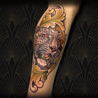 Custom neotraditional leopard tattoo