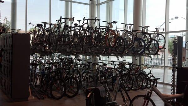 Just one of the rows of bikes; a set of lockers (avail. to members); & an electric bike awaiting valet (avail. to all).