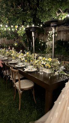 Farm tables and cross back chairs with cushion.