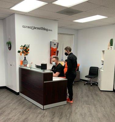 Reception desk with Chad & Dr. Lisa.