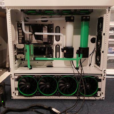 Custom gaming computer with white and green liquid cooling