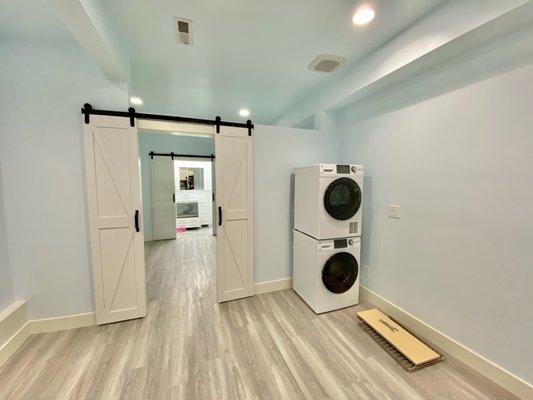 Left side of room After. Standing in the kitchen looking toward the bathroom.