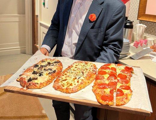 Pizza cooked in our brick oven.