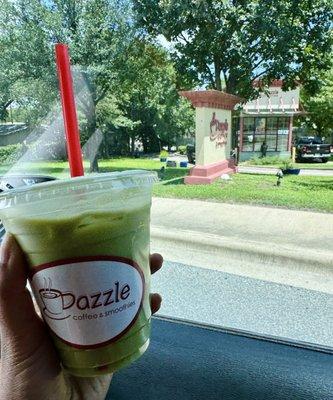 Iced Latte (Matcha) . Dazzle coffee shop in the background