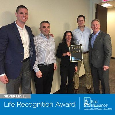 Preferred Insurance Services located in Fairfax, Virginia accepts the Silver Life Recognition Award from Erie Insurance. (703) 359-5910.