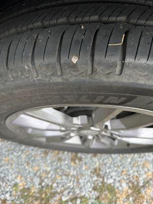 Two nails in driver rear tire.