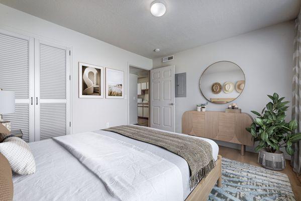 Bedroom with white walls and hardwood flooring