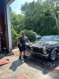 Selena washing a an old-school Chevy we worked on!