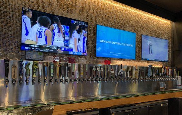 The sizable beer wall...whatcha gonna drink?