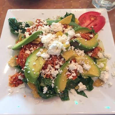 Salad with shredded chicken and avocado