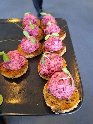 Goat cheese with beets on a cracker