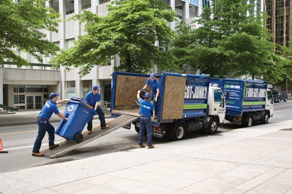 1-800-GOT-JUNK? team loading the dumpsters