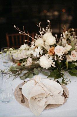 We used the flowers from the arch as our tablescape later in the evening