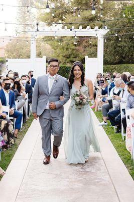 Bridesmaid walking down the aisle at Sierra La Verne | Socal Wedding Venue