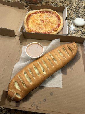 Plain Cheese Pizza and Cheesesteak Stromboli