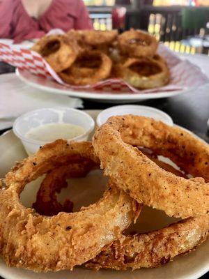 Hand battered onion ring. Absolutely amazing. Delicious. $8. (?)