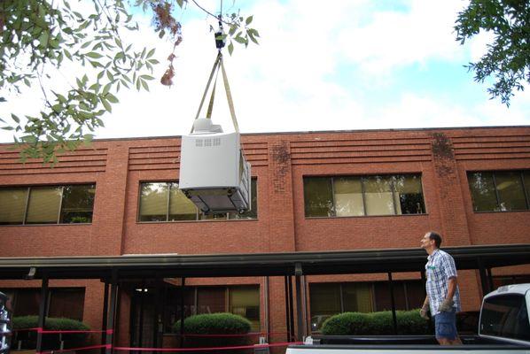 Hoisting large copy machine to 2nd floor office of Hussey,Gay & Bell Architects