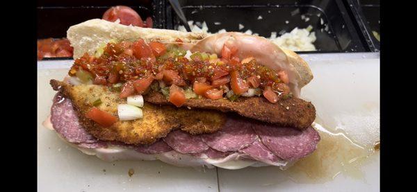 sadi special , italian sub with a fresh fried cutlet with everything