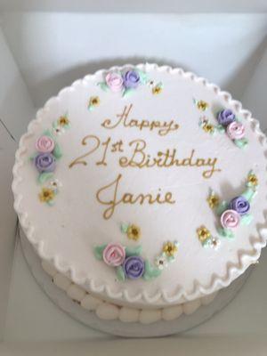 chocolate cake w/ganache filling, pale pink frosting, gold lettering & tiny pretty flowers