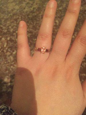 My beautiful engagement ring: a padparadscha sapphire with two garnets.