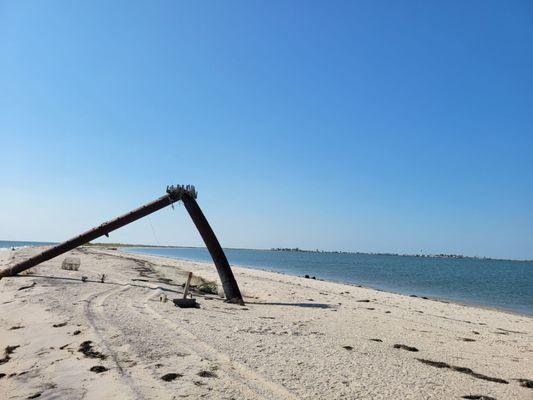 Old mast at the end of the beach. During low tide you can walk pretty far out into the bay on the sand bar.