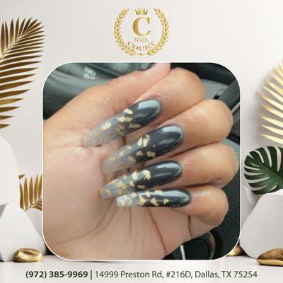 Dripping in gold!  These black ombre nails with delicate gold foil accents are the epitome of edgy elegance.