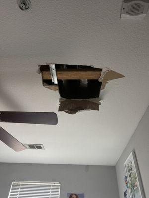 Ceiling hole that was eventually taped up with a cardboard box